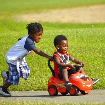 Kids playing with car